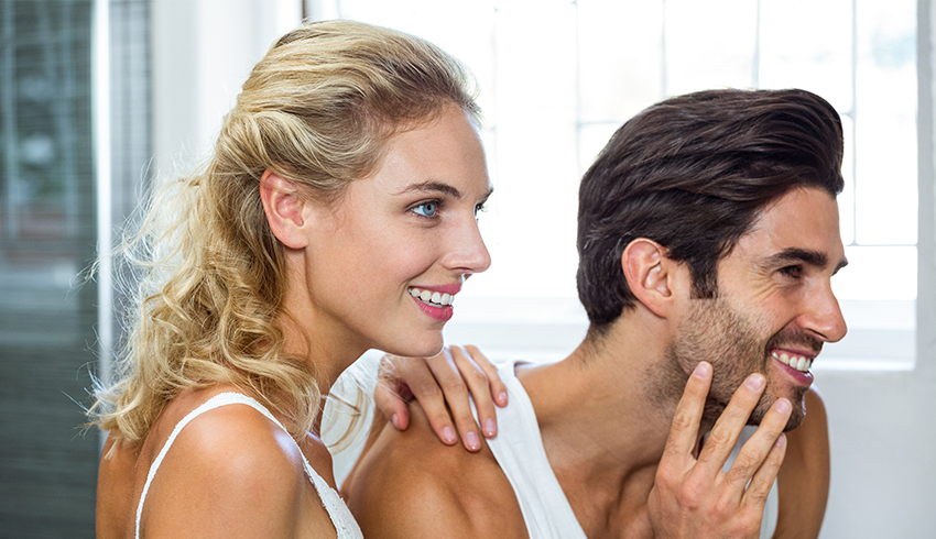 Man and woman doing a skin care routine